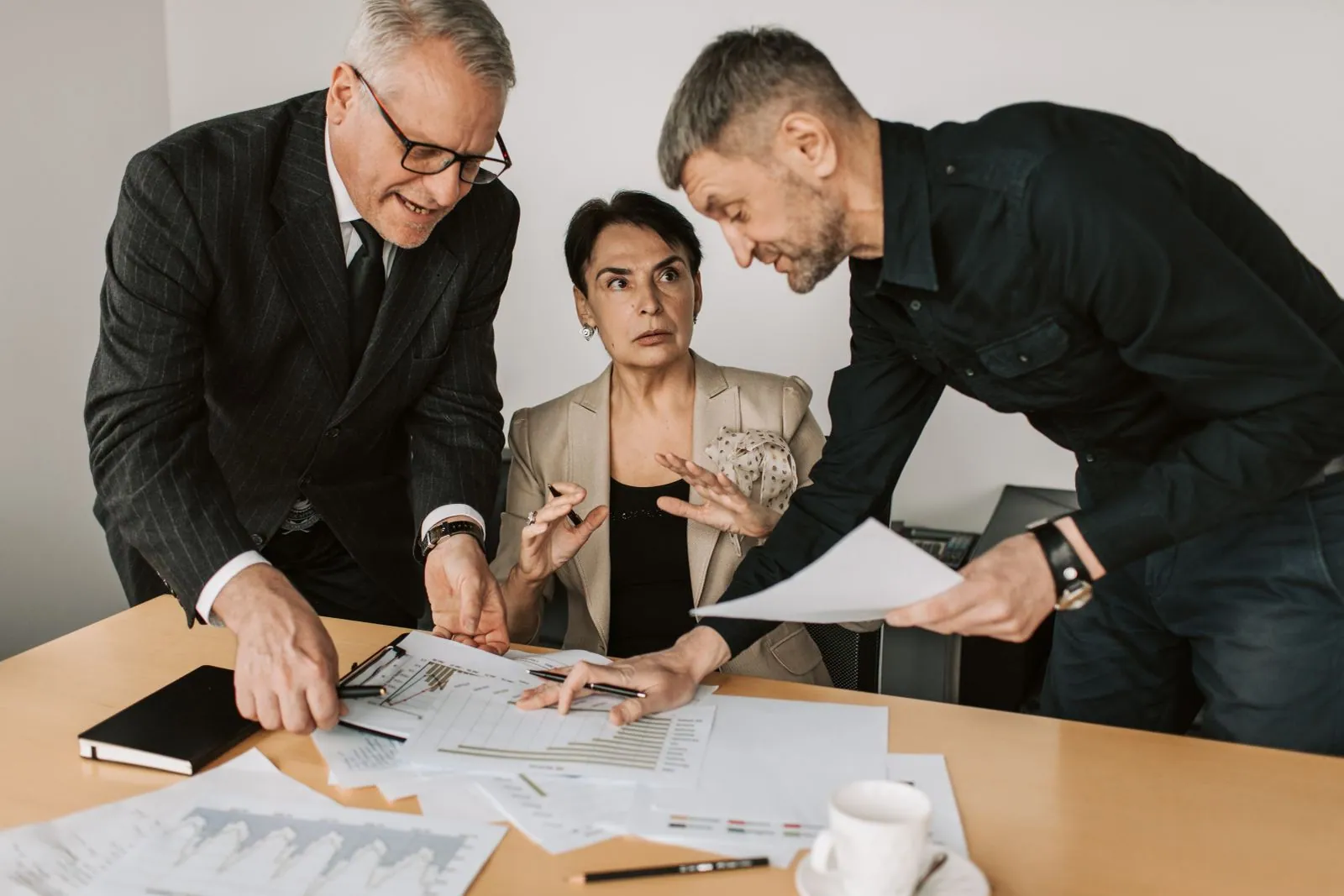 Colleagues reviewing contract documents together