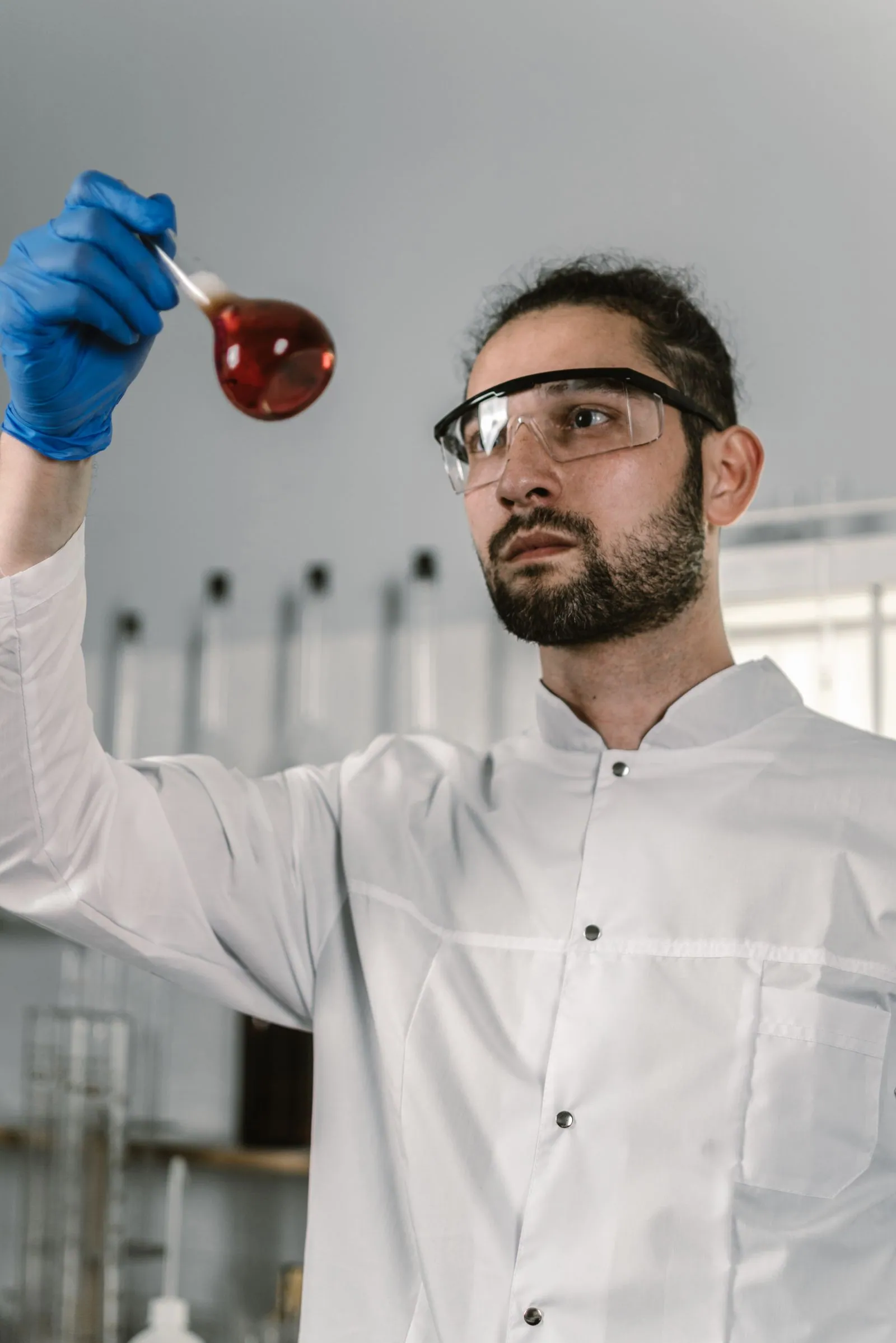 Technician running a laboratory test on a petroleum sample