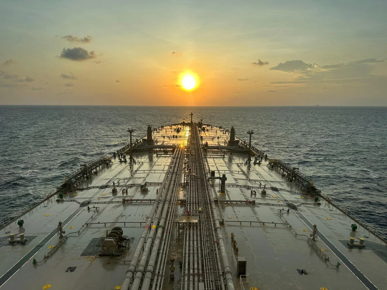 Deck of a crude tanker at sunset